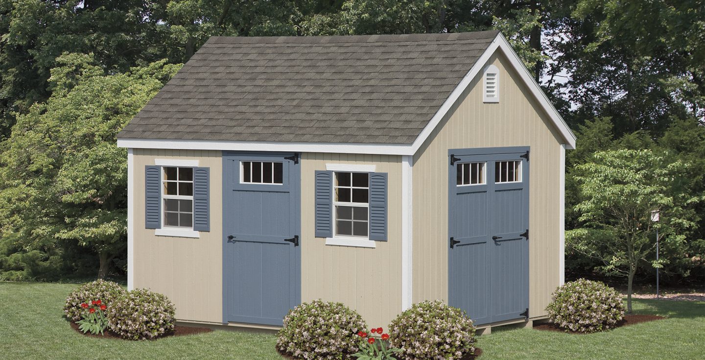tan vinyl new england shed with blue trimmings