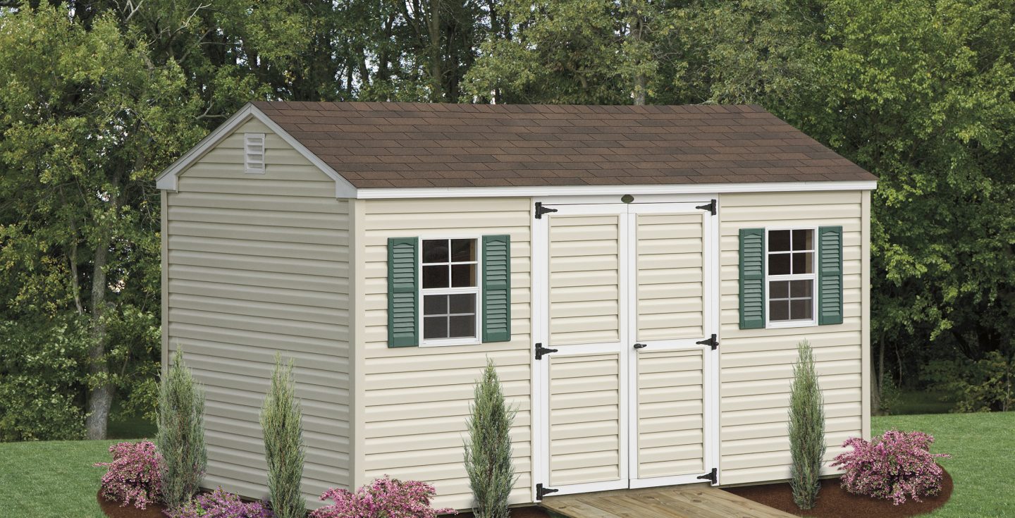 tan a frame small shed with green shutters