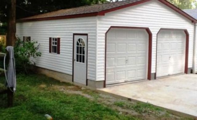 side view of a white two car garage